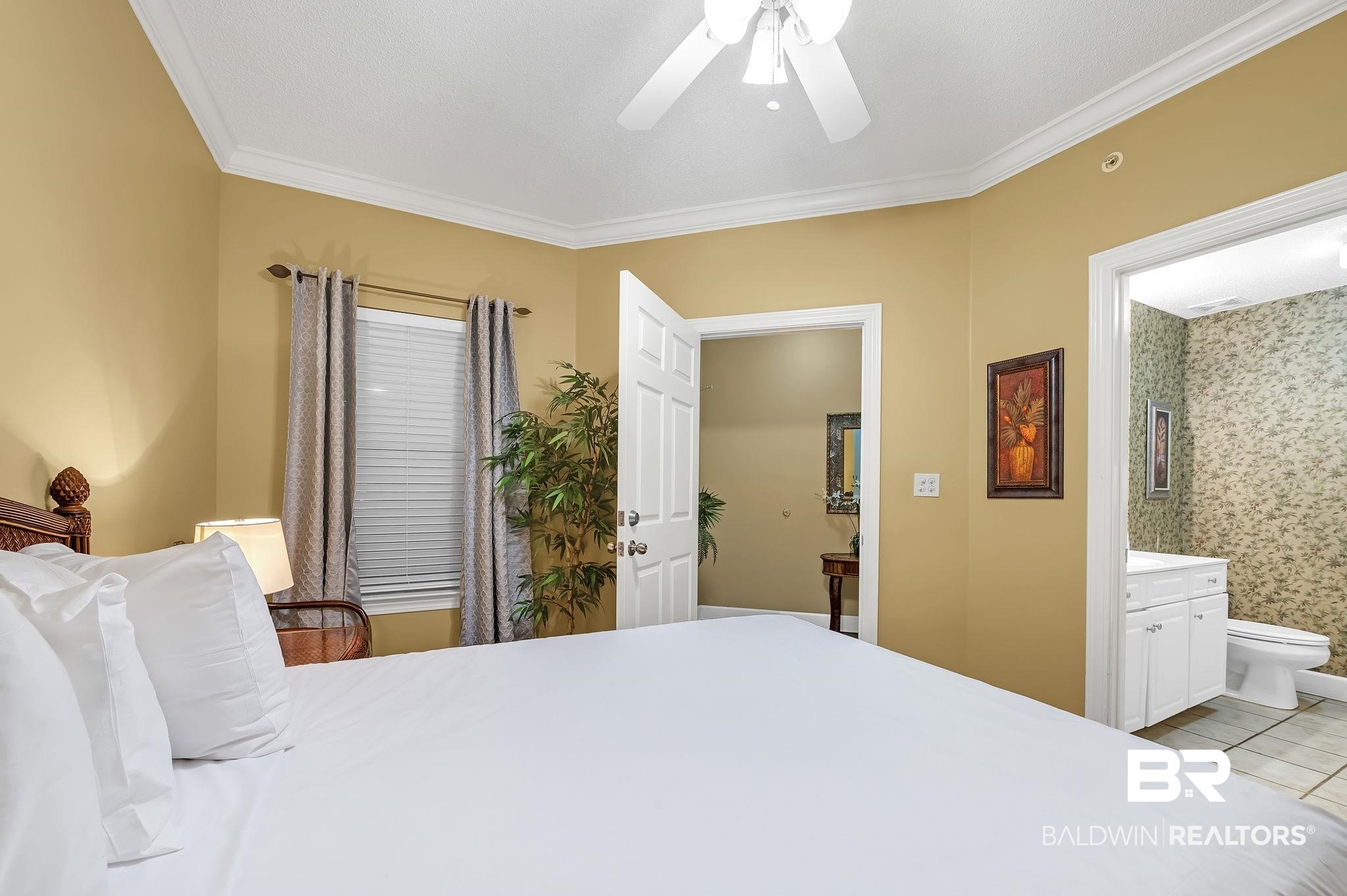 27580 Canal Road, Unit 1214 AND BOAT SLIP #62 Orange Beach, AL 36561 - Photo 35 of 67 Bedroom featuring light tile patterned floors, ensuite bathroom, crown molding, and ceiling fan