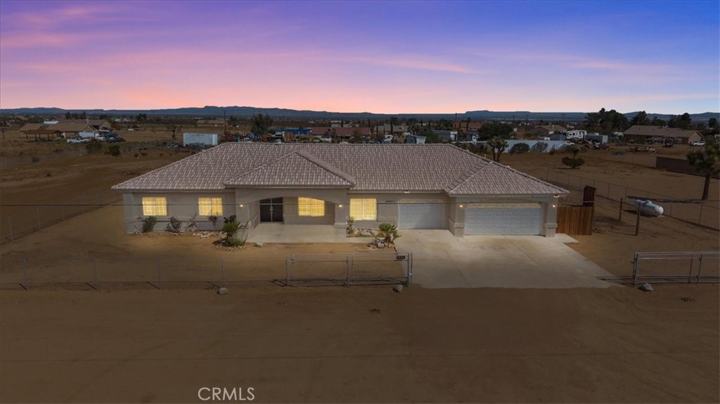 a view of a house with a street