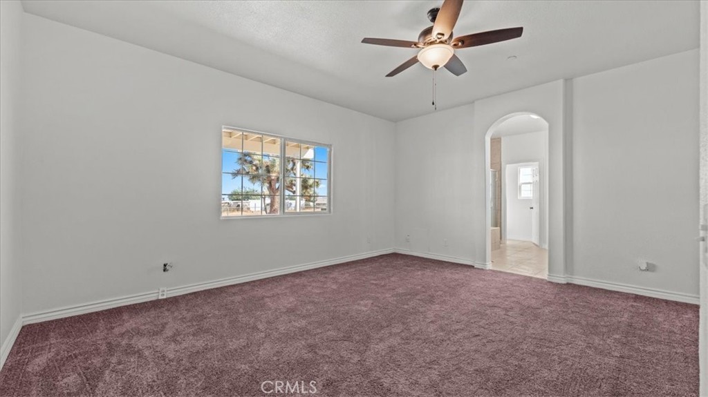 7536 Sunset Road Phelan, CA 92371 - Photo 16 of 40 a view of an empty room with a window