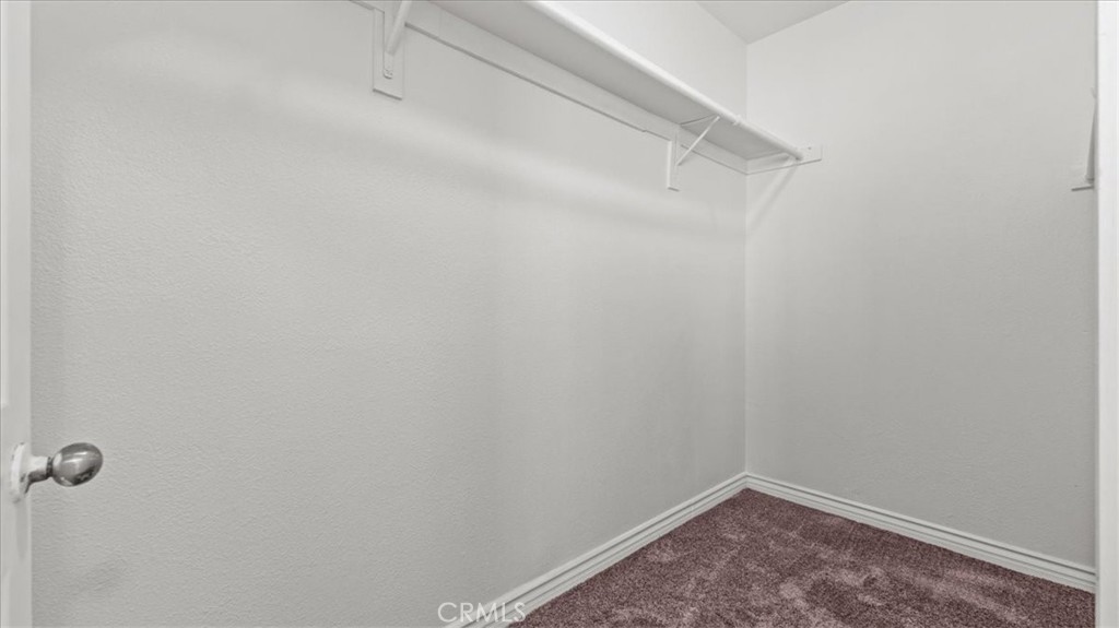 7536 Sunset Road Phelan, CA 92371 - Photo 21 of 40 a view of a room with racks on the wall