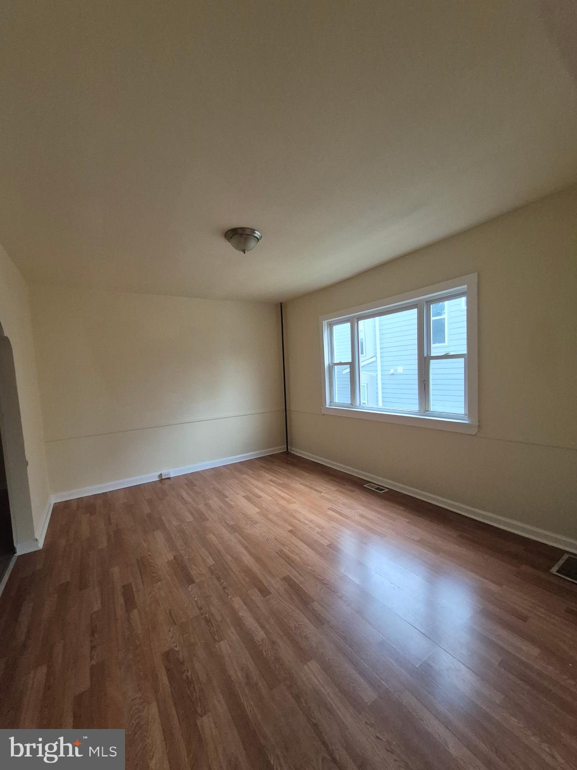 1245 Empire Avenue, Unit 1 Camden, NJ 08103 - Photo 7 of 7 a view of an empty room and window