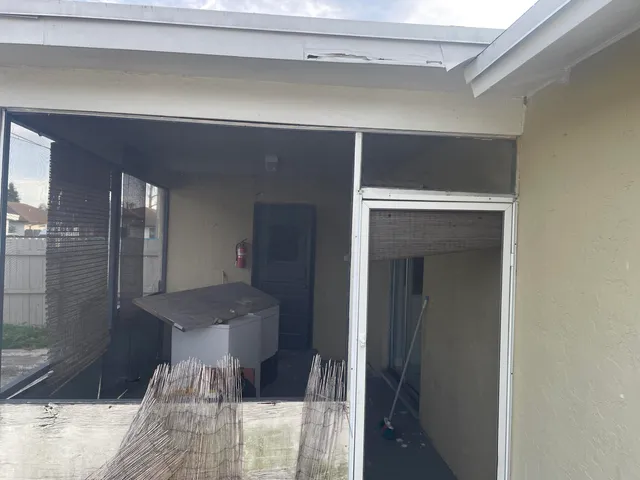 a bathroom with a glass shower door