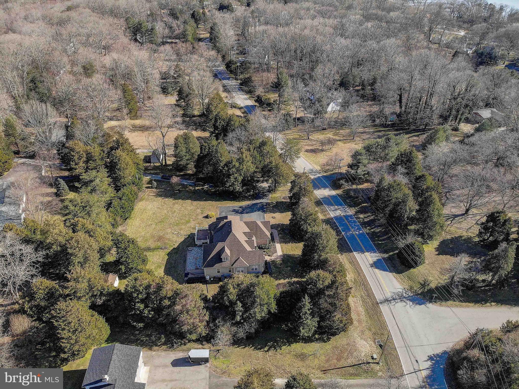 3300 Holland Cliffs Road Huntingtown, MD 20639 - Photo 85 of 93 an aerial view of a house with a yard and lake view