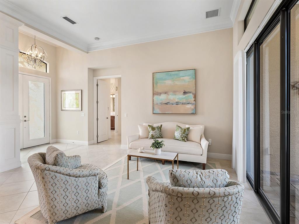 15207 Camargo Place Lakewood Ranch, FL 34202 - Photo 21 of 96 a living room with furniture and a window