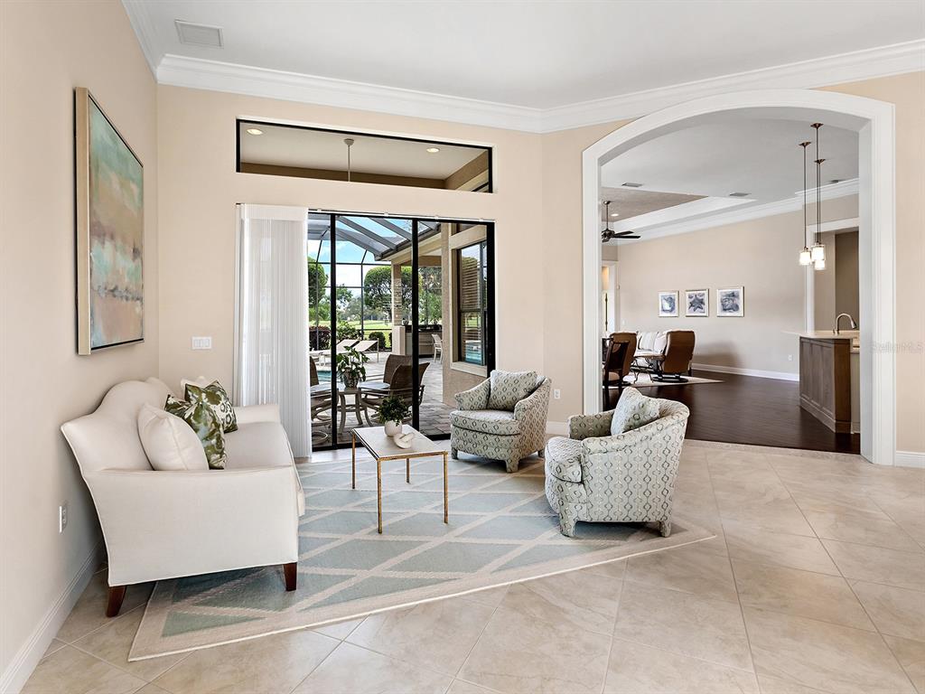 15207 Camargo Place Lakewood Ranch, FL 34202 - Photo 22 of 96 a living room with furniture and a large window
