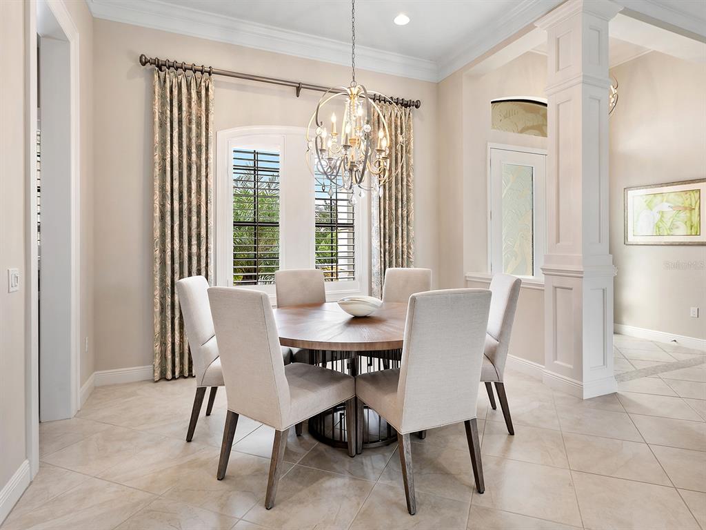 15207 Camargo Place Lakewood Ranch, FL 34202 - Photo 25 of 96 a view of a dining room with furniture window and outside view
