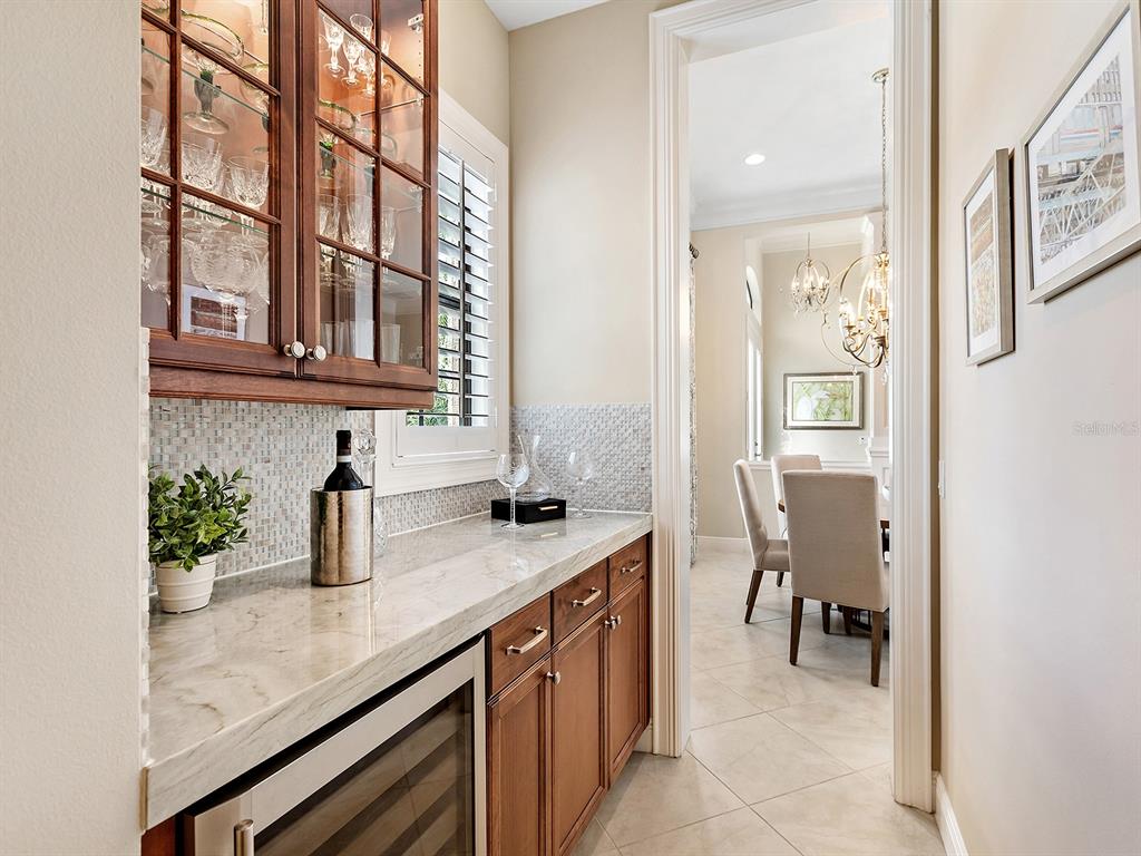 15207 Camargo Place Lakewood Ranch, FL 34202 - Photo 27 of 96 a kitchen with a sink and cabinets