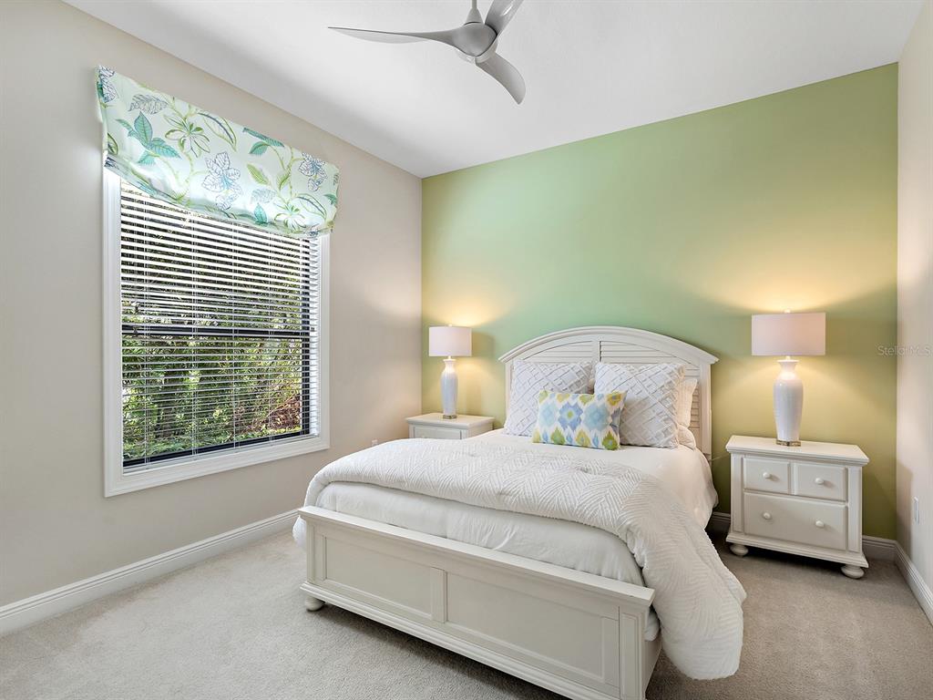 15207 Camargo Place Lakewood Ranch, FL 34202 - Photo 50 of 96 a bedroom with a bed and a window