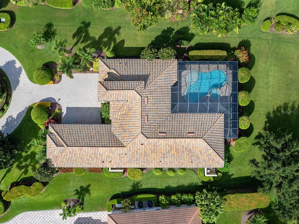 15207 Camargo Place Lakewood Ranch, FL 34202 - Photo 74 of 96 an aerial view of a house with a yard