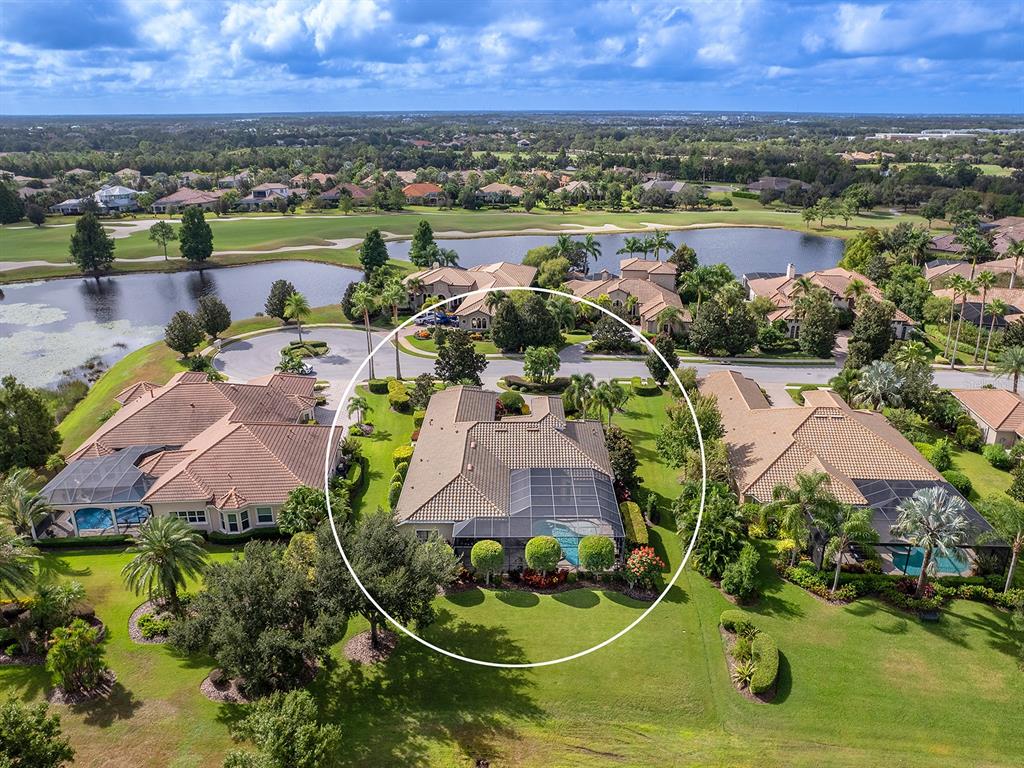 15207 Camargo Place Lakewood Ranch, FL 34202 - Photo 76 of 96 an aerial view of a house with a swimming pool and outdoor seating