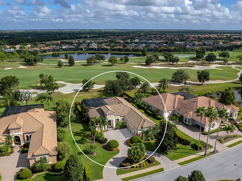 15207 Camargo Place Lakewood Ranch, FL 34202 - Photo 77 of 96 an aerial view of residential houses with outdoor space and river