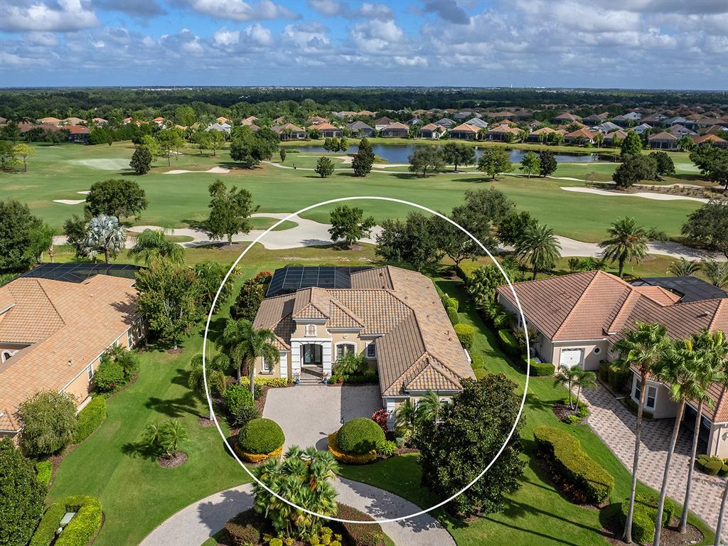 15207 Camargo Place Lakewood Ranch, FL 34202 - Photo 78 of 96 an aerial view of a house with a garden