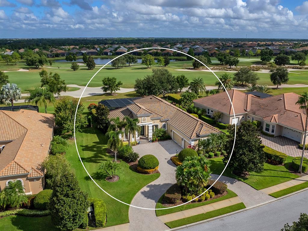 15207 Camargo Place Lakewood Ranch, FL 34202 - Photo 79 of 96 an aerial view of a house with a garden and houses