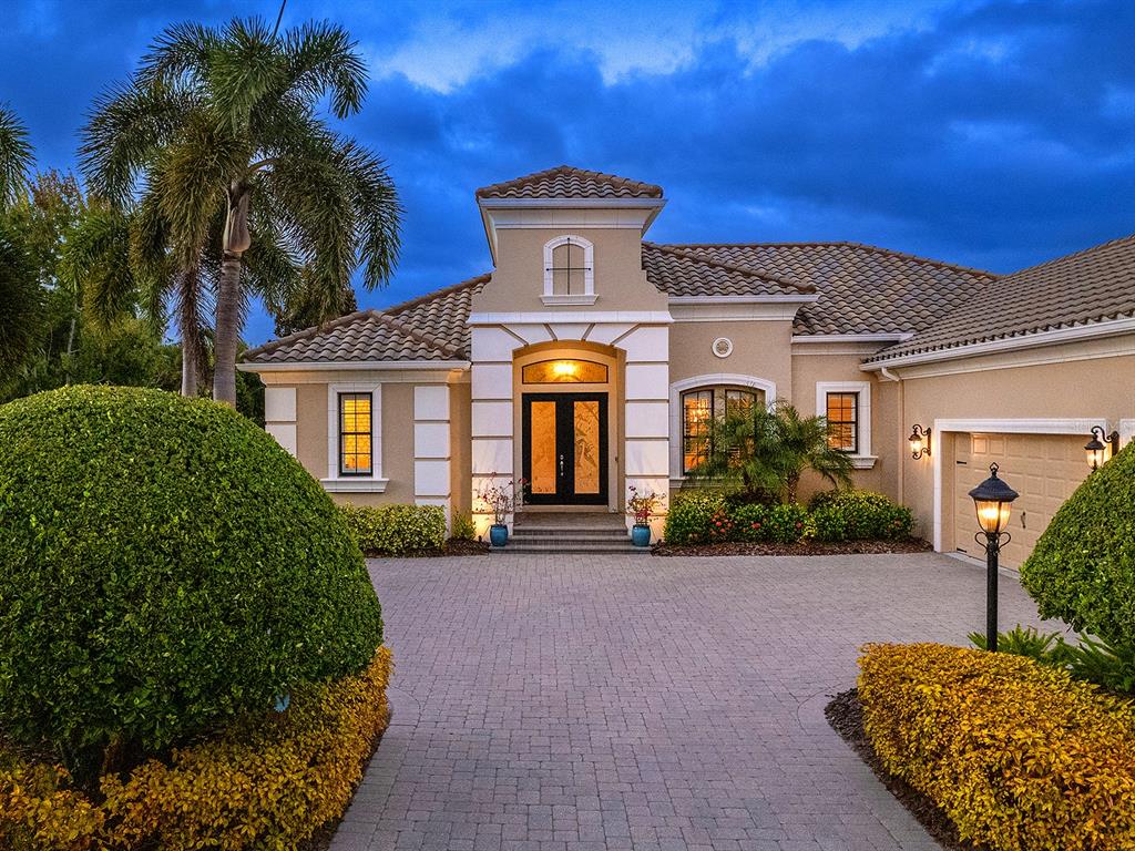 15207 Camargo Place Lakewood Ranch, FL 34202 - Photo 83 of 96 a front view of a house with yard