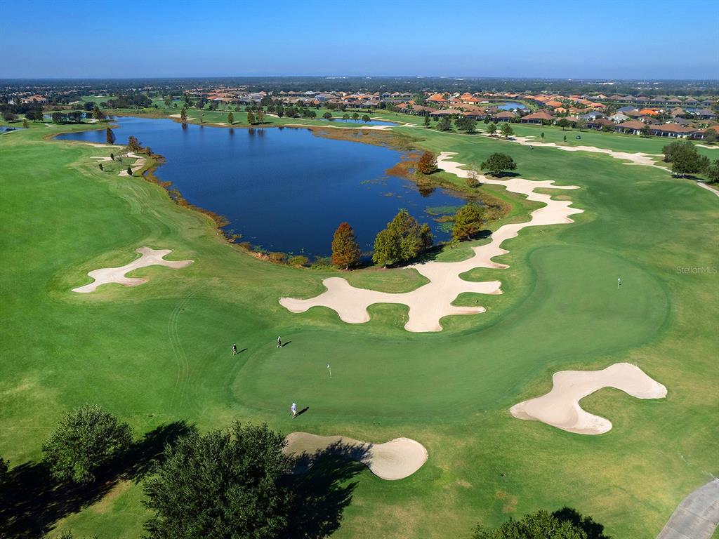15207 Camargo Place Lakewood Ranch, FL 34202 - Photo 88 of 96 a view of a lake with a city