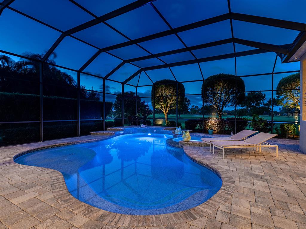 15207 Camargo Place Lakewood Ranch, FL 34202 - Photo 9 of 96 a view of a swimming pool with wooden floor