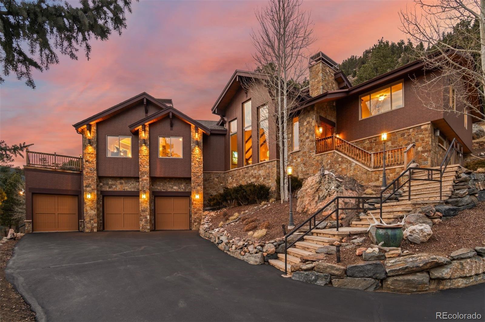 127 Granite Way Evergreen, CO 80439 - Photo 1 of 48 a view of a house with a snow in the background