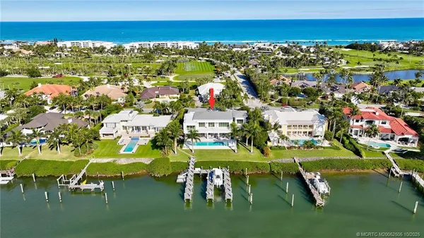 a view of a lake with houses in the back