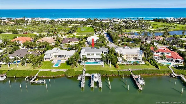 a view of a lake with houses in the back