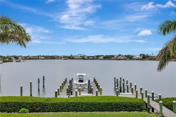 a front view of a multi story building with yard