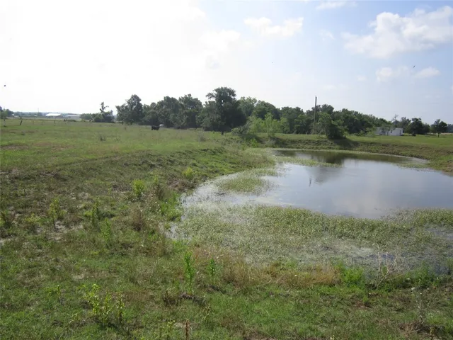 a view of a lake with a yard