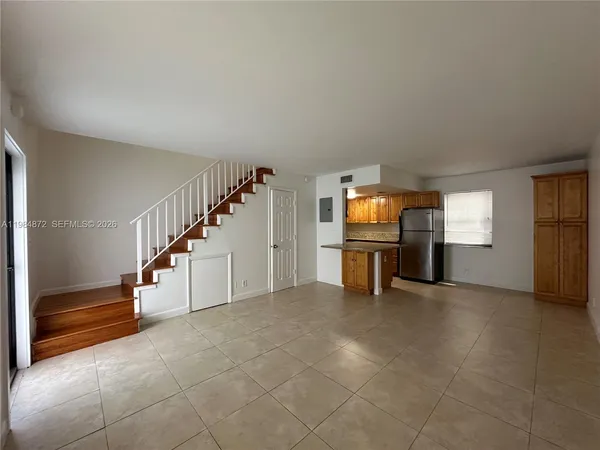 a view of a livingroom with a staircase