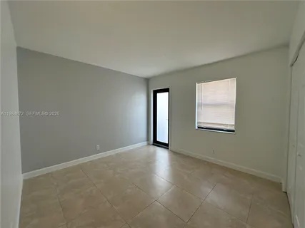 an empty room with closet area