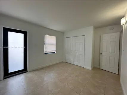 a view of a house next to a yard