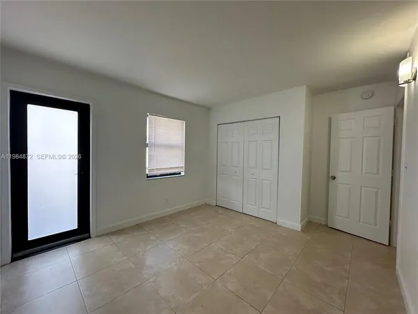 a view of a house next to a yard