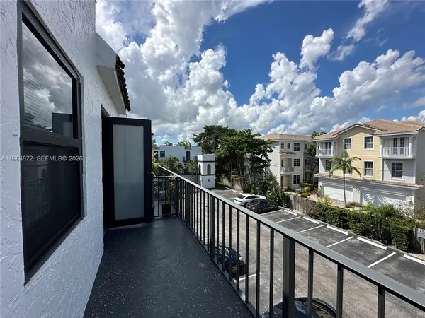 a view of a street from a balcony