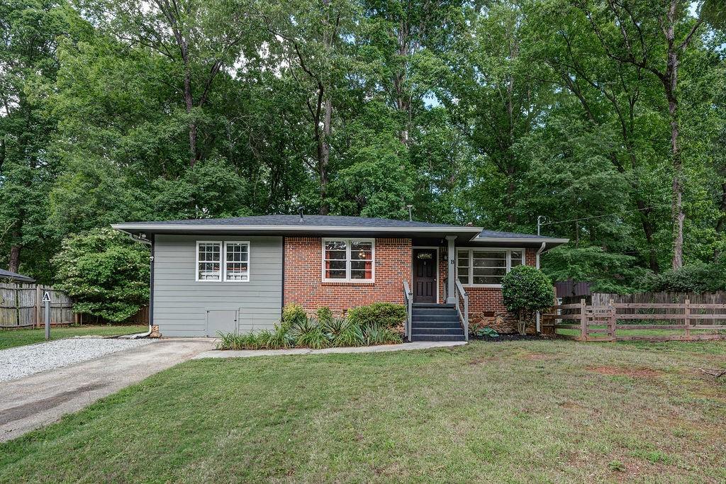 1140 Allgood Road Stone Mountain, GA 30083 - Photo 1 of 25 front view of a house with a yard