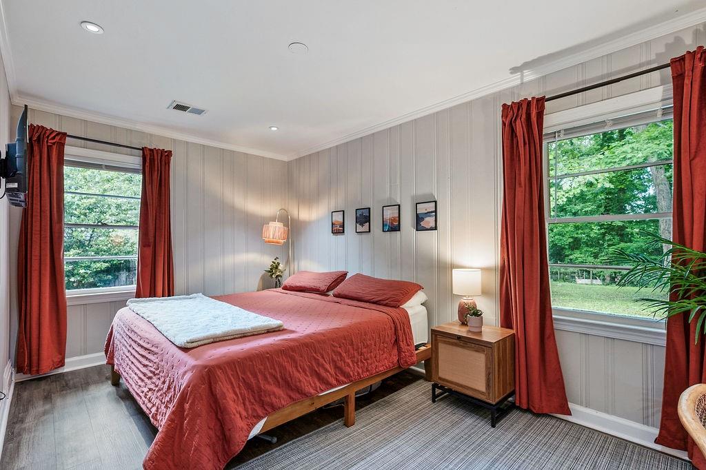 1140 Allgood Road Stone Mountain, GA 30083 - Photo 11 of 25 a bedroom with a bed and a large window