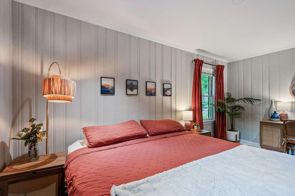 1140 Allgood Road Stone Mountain, GA 30083 - Photo 12 of 25 a bedroom with a bed and a lamp with window