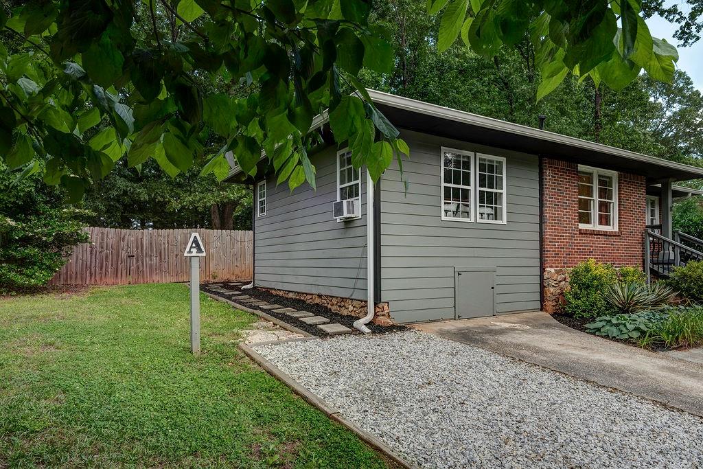 1140 Allgood Road Stone Mountain, GA 30083 - Photo 18 of 25 a backyard of a house with lots of green space