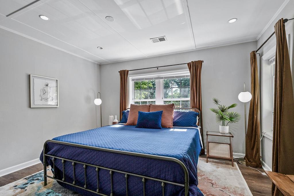 1140 Allgood Road Stone Mountain, GA 30083 - Photo 20 of 25 a bedroom with a large bed and a window