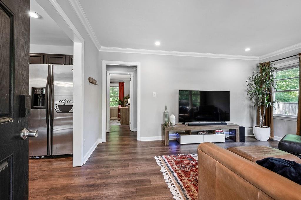 1140 Allgood Road Stone Mountain, GA 30083 - Photo 3 of 25 a living room with furniture and a flat screen tv