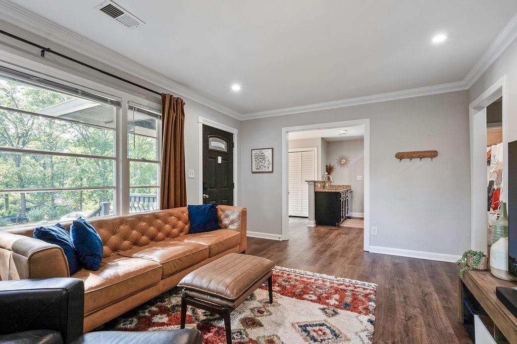 1140 Allgood Road Stone Mountain, GA 30083 - Photo 5 of 25 a living room with furniture and a large window