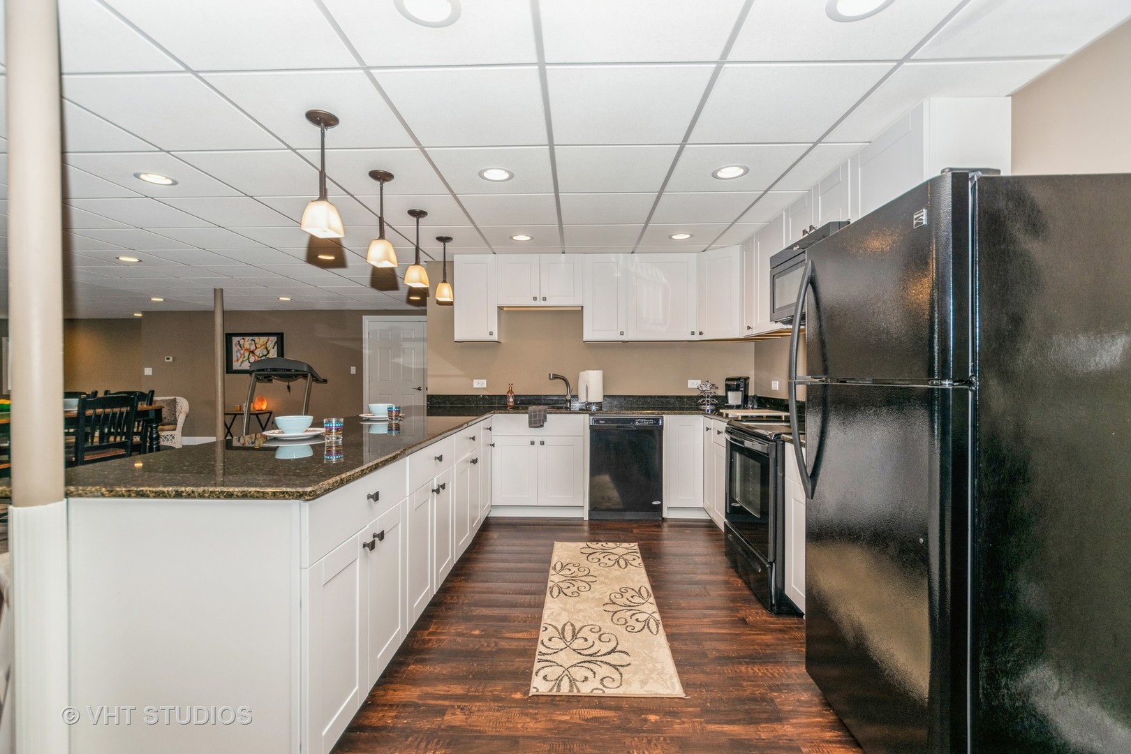 9424 West Pauling Road Monee, IL 60449 - Photo 8 of 19 a large kitchen with stainless steel appliances kitchen island granite countertop a refrigerator a sink dishwasher a stove and a refrigerator with wooden floor