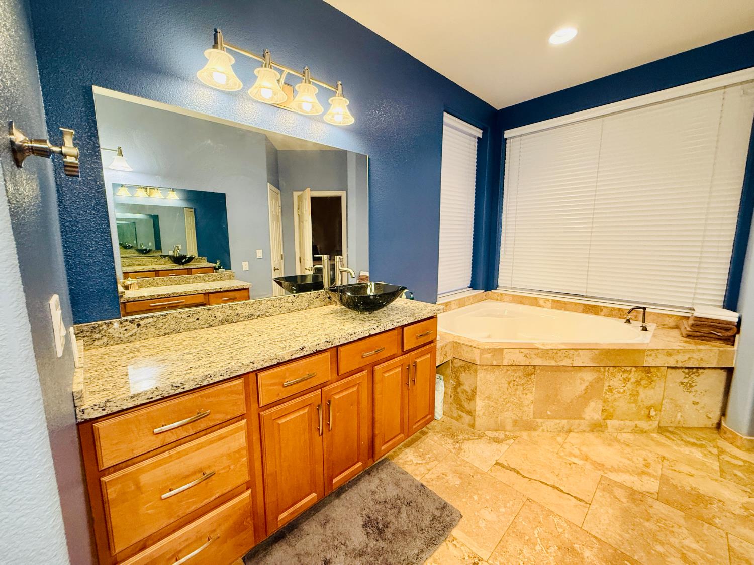 611 Sunrise Road Copperopolis, CA 95228 - Photo 10 of 29 a bathroom with a granite countertop sink and a mirror