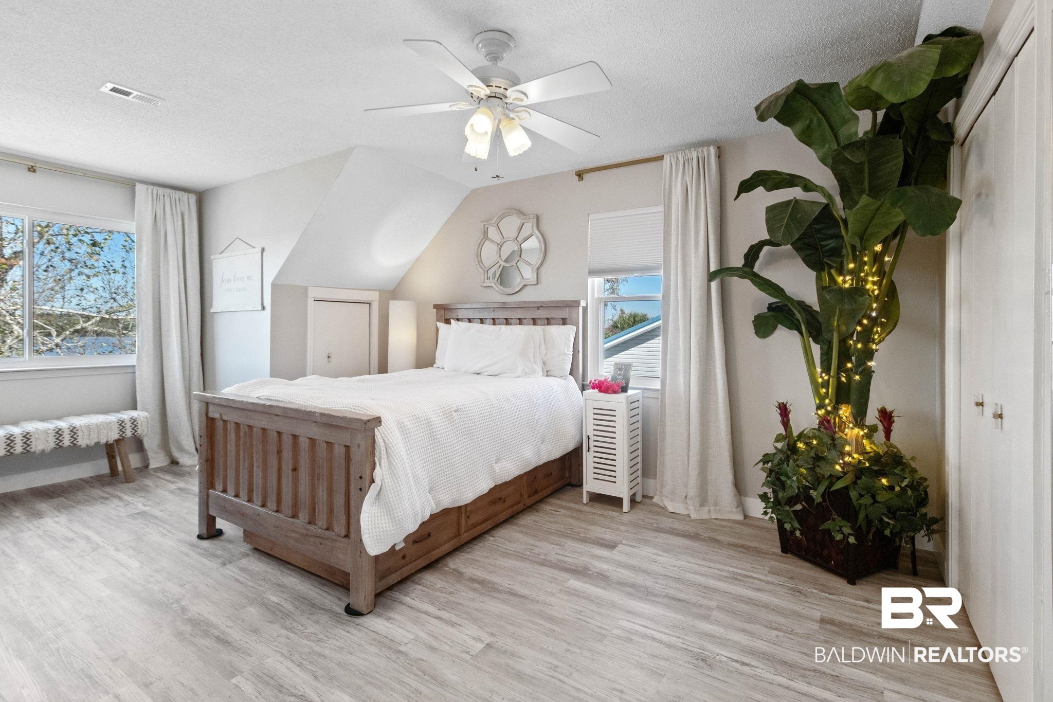 41997 Bayou Road Bay Minette, AL 36507 - Photo 41 of 68 Bedroom featuring light wood finished floors, vaulted ceiling, a ceiling fan, and an abundance of natural light