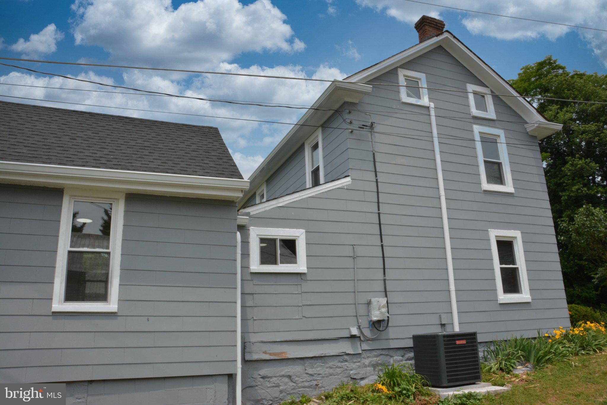 1006 Circle Drive Keymar, MD 21757 - Photo 45 of 45 Charming gray home under blue skies.