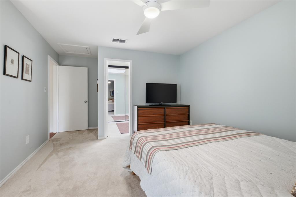 4040 Rive Lane Addison, TX 75001 - Photo 19 of 40 Another angle of the second bedroom, showing the room's size and the easy access to the upstairs bath just through the adjoining door.
