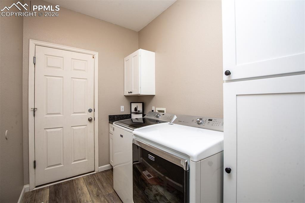 9066 Copenhagen Road Peyton, CO 80831 - Photo 18 of 34 a utility room with sink dryer and washer