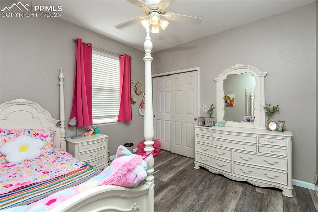 9066 Copenhagen Road Peyton, CO 80831 - Photo 20 of 34 a bedroom with a bed and a dresser in it