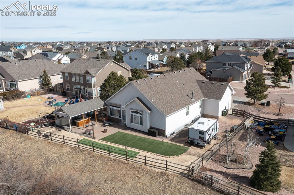 9066 Copenhagen Road Peyton, CO 80831 - Photo 27 of 34 an aerial view of a house with a garden and mountain view in back