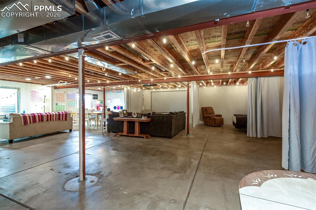 9066 Copenhagen Road Peyton, CO 80831 - Photo 29 of 34 a view of a room with gym equipment