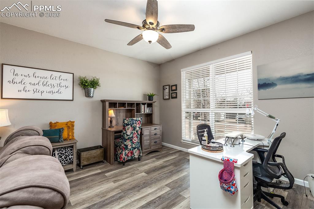 9066 Copenhagen Road Peyton, CO 80831 - Photo 8 of 34 a view of a workspace with furniture and a window