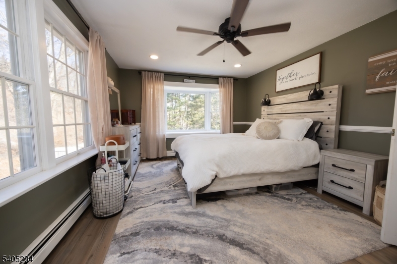 8 Luchetti Way Newton, NJ 07860 - Photo 15 of 20 a bedroom with a bed a chandelier and next to a window