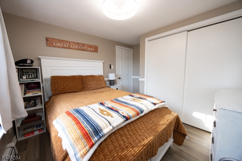 8 Luchetti Way Newton, NJ 07860 - Photo 16 of 20 a bedroom with a bed and wooden floor