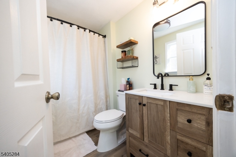 8 Luchetti Way Newton, NJ 07860 - Photo 18 of 20 a bathroom with a toilet sink and mirror